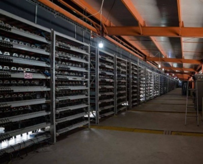 Vast cryptocurrency mining farm with rows of machines